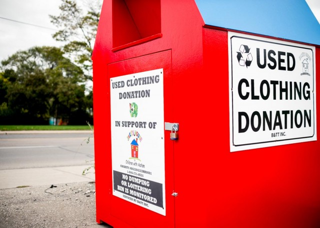 big, red clothing donation bin outside