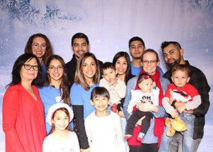 A group of partygoers in the Jake's House Toronto Holiday Photo Booth