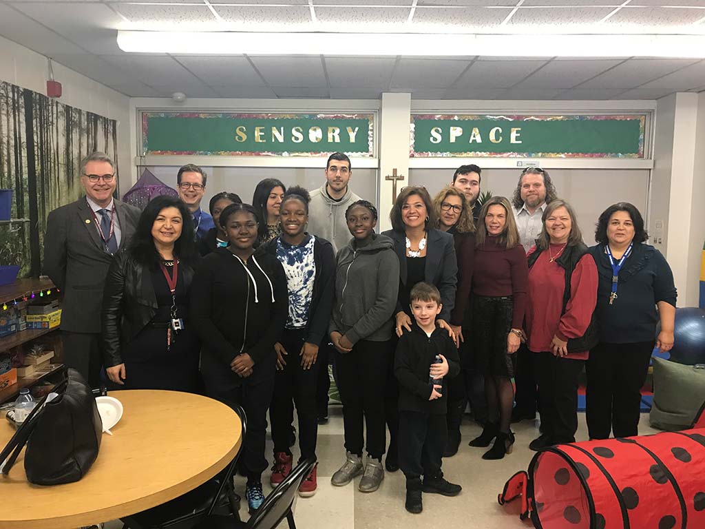 a group picture taken in a school classroom