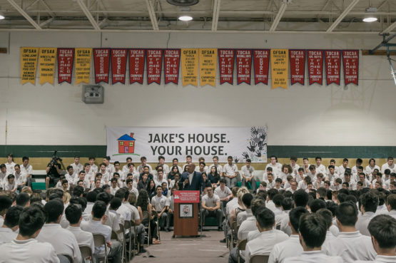 an assembly in a school gymnasium