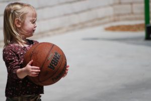 autism volunteer opportunity girl playing basketball